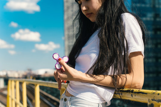 Playing with fidget spinner