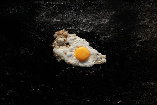 Cooking egg on a rock