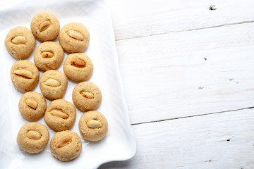 Homemade penut butter cookies on white plate, copy space