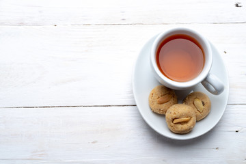 Top view tea and peanut cookies, copy space