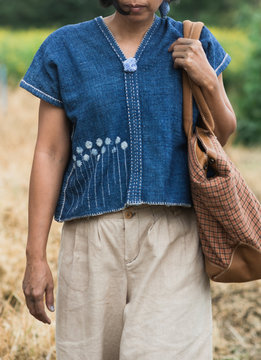 Asian woman wearing natural indigo dye cloth.