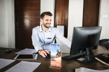 Receptionist working at the front desk