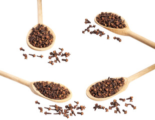 Dried carnations in a wooden spoon isolated on a white background