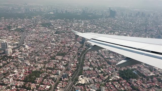 Aerial view over Mexico from airplane as it starts to land.