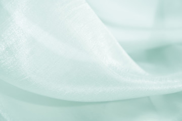 The texture of the satin fabric of blue color for the background   