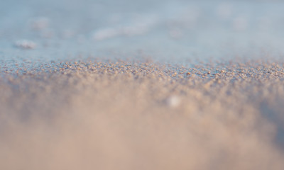 Selective focus, Close up of sea waves splashing on the beach