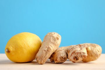 Lemon and ginger on wooden and blue backgorund