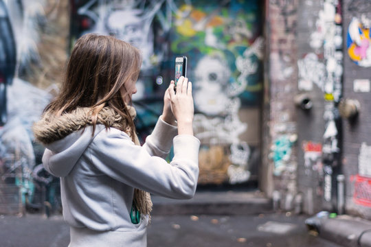 young teens on holiday in Melbourne, visiting the art laneways