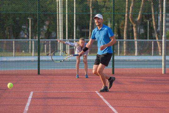 Male tennis player being excited by scoring in tennis competition