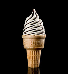 ice cream cone on a black background with reflection