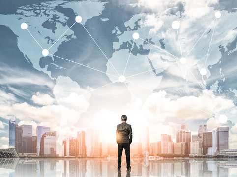 Businessman looking at global business with city background