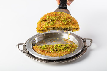 Kunefe with pistachio. Turkish dessert kunefe, with pistachio powder. 