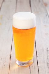 A glass of beer on the table