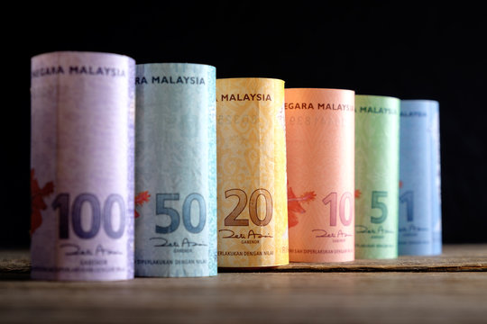 Row of Malaysia Ringgit on wooden table