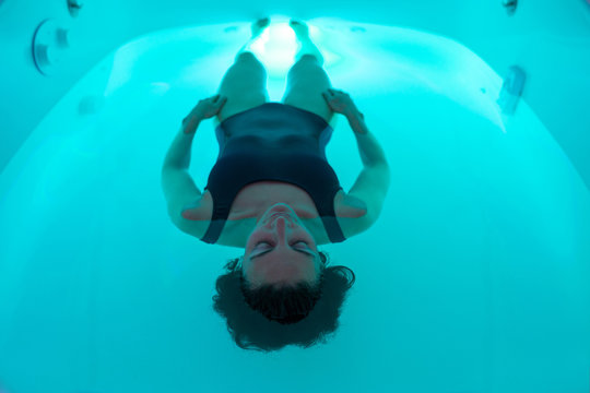 Relaxed woman during sensory deprivation float experience