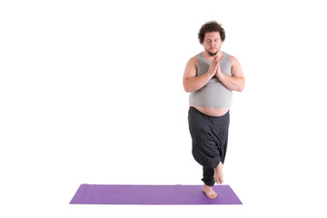 Funny fat man and yoga. White background. 