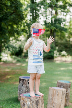 Child holding American flag