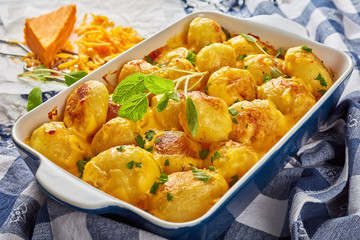 new potatoes baked with cheddar cheese
