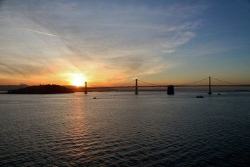 Fototapeta na wymiar Sun rise over the Bay Bridge in San Francisco, California