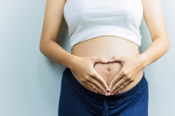 Pregnant women wearing white shirt