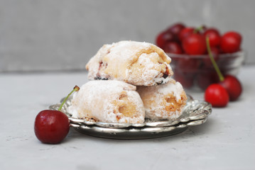 Homemade Biscuit cookies Rolled with cherry jam on gray background. Sweet Dessert.