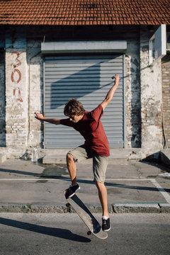 Teenager jumping with his skateboard