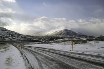 Ice and snow covered road in Iceland mountain region