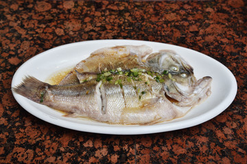 Chinese style steamed fish in soy sauce 
