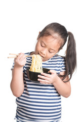 Asian child girl age 7 year ,  eating Instant noodles on white background