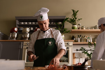 Cook making dish in restaurant