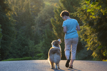 Woman walking dog