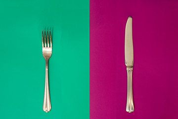 Fork on purple background. Knife on a bright turquoise background. concept. Seamless pattern