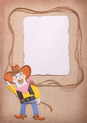 Cowboy in wild west hat with lasso and paper background. Paper cut application