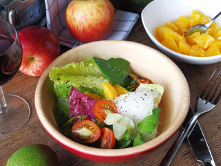 Vegetable salad on a wooden dish        