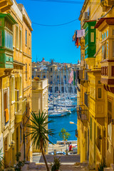 View of a narrow street in the historical center of Senglea, Malta - obrazy, fototapety, plakaty