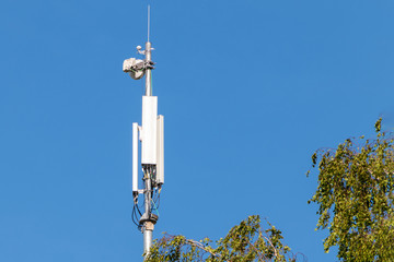 Antenna cellular and Internet on a pole against the sky