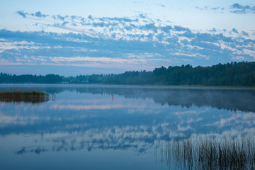 Obraz na płótnie Canvas blue hour sky and lake in dawn