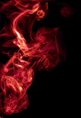 Red smoke on black background