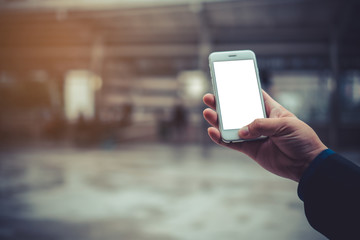 Businessman using his Mobile Phone outdoor, White screen Text input, close up, Copy space, Vintage...