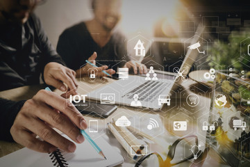 Co worker using VOIP headset with digital tablet computer docking smart keyboard, concept communication, it support, call center and customer service help desk,filter film effect