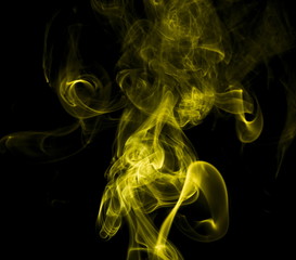 Yellow smoke on black background