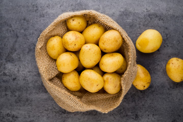 A bio russet potato wooden vintage background.