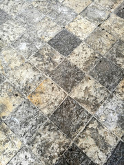 The texture of the stone pavement in the old town