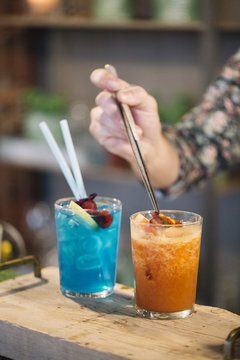 Barman serving cocktail