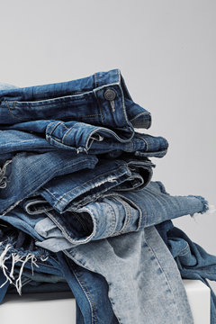 a pile of blue jeans