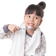 Little girl brushing her teeth isolated on white background