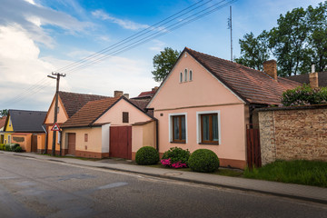 Fototapeta na wymiar Road and houses in Czech village