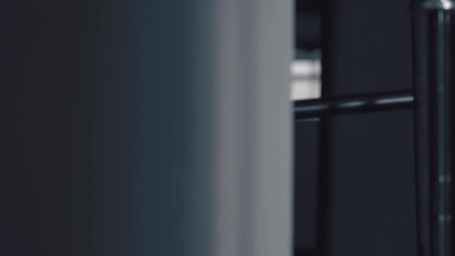 A brutal bearded man, an athlete takes the bar; strong man, weightlifting, crossfit. Man is engaged in sports with heavy weight. Shooted against a dark background. Concept strength, sport, endurance.