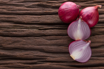red onions on rustic wood
