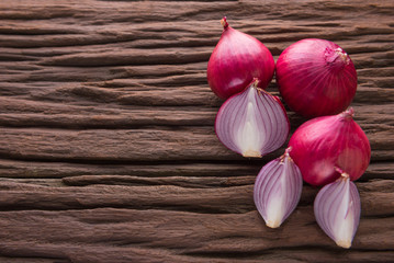 red onions on rustic wood